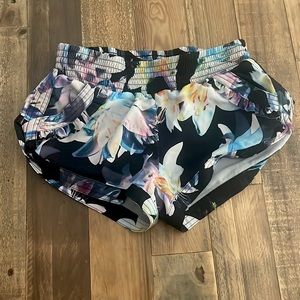These are Jo and Jax shorts with a flower design. Size YM.
